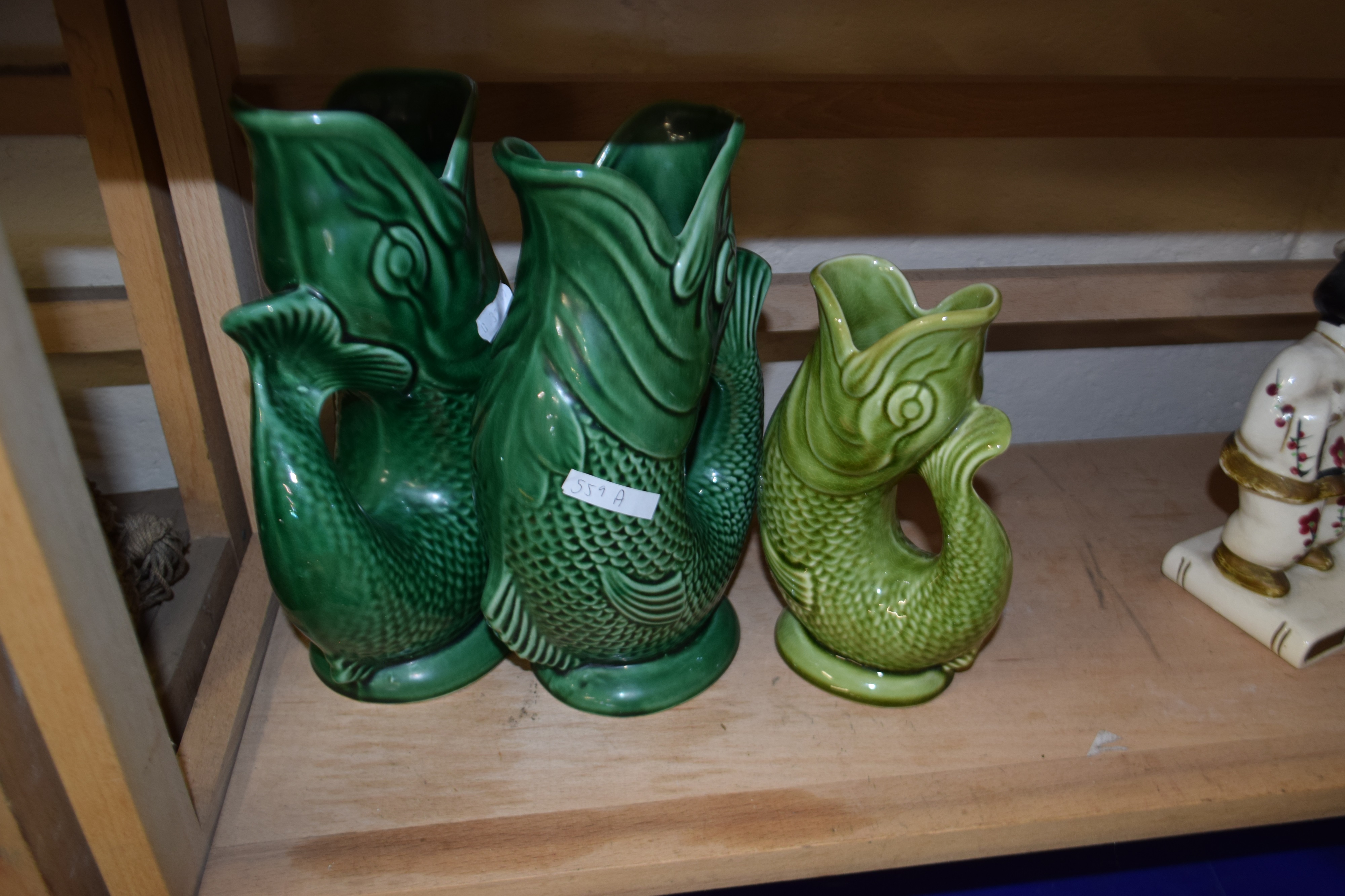 Two green glazed Dartmouth Pottery fish vases and another smaller - Image 2 of 2