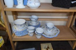 Quantity of Duchess china decorated with blue trim and floral decoration