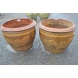 Pair of modern planters decorated with dragon detail, 40cm diametre