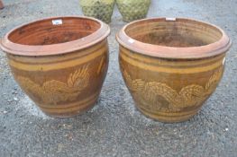 Pair of modern planters decorated with dragon detail, 40cm diametre