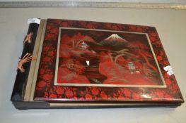 Japanese lacquered photograph album with integral musical movement, no photographs within