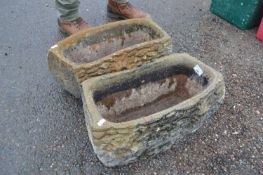 Two concrete log formed planters, 46cm long