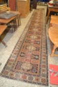 Large modern wool runner carpet decorated with a continuous design of lozenges, 660cm long x 86cm
