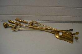 Set of three brass fire tools