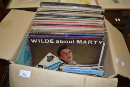 Large box of assorted records and singles