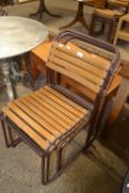 Set of four Cox metal framed and slatted wood stacking chairs