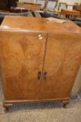 20th Century walnut veneered two door linen press cabinet with four internal drawers, 77cm wide