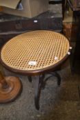 Cane topped pedestal table