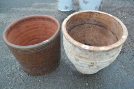 Two large terracotta plant pots, largest 43cm diameter
