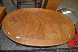 Modern oak veneered oval coffee table