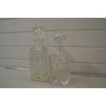 Two clear glass spirit decanters