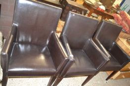 Set of four modern leather covered armchairs