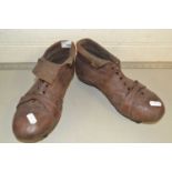 A pair of vintage leather football boots