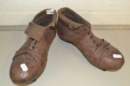 A pair of vintage leather football boots