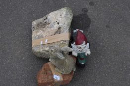 Two natural rocks together with a gnome and a small concrete bunny rabbit (4)