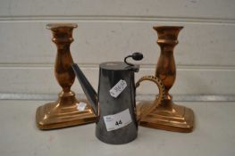 Pair of 19th Century copper candlesticks together with a small silver plated jug