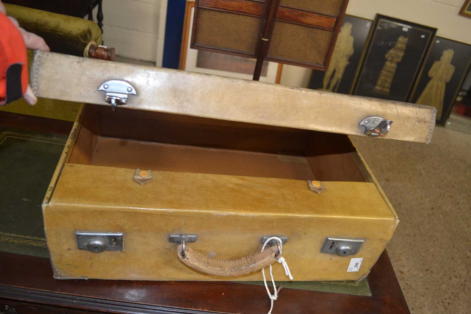 A pigskin covered suitcase