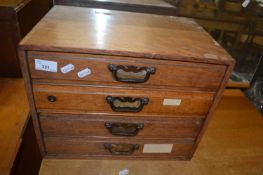 Small table top four drawer chest