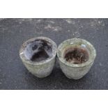 Pair of concrete planters decorated with great leaf detail, 32cm diametre