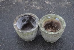Pair of concrete planters decorated with great leaf detail, 32cm diametre