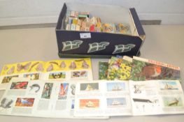 Shoe box of various cigarette cards and albums of tea cards