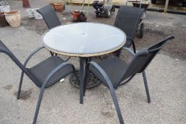 Modern glass topped garden table and four chairs