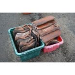 Two boxes of various roof tiles and ridge tiles