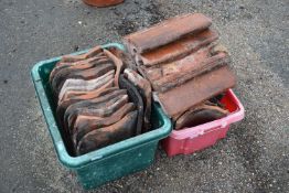 Two boxes of various roof tiles and ridge tiles
