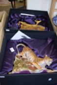 Two large resin figures from The Earth Collection of a tiger and an antelop, boxed with