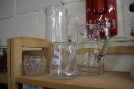 Three glass jugs and dish