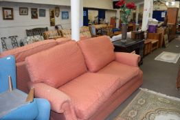 Pair of Marks & Spencers salmon upholstered sofas with loose cushions
