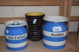 Two Cornish ware containers and a black and white striped vase