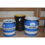 Two Cornish ware containers and a black and white striped vase