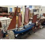 Large three mast model boat on a four wheel hand trailer, boat is approx 210cm long, appears to have