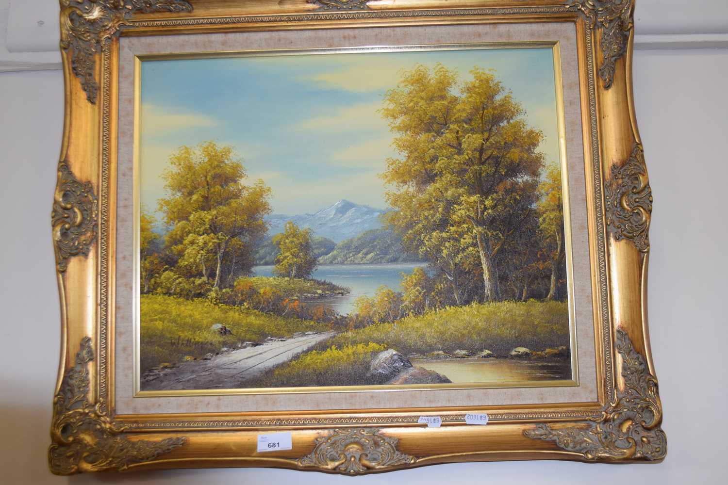 Lake and mountain scene, oil on canvas in modern gilt frame