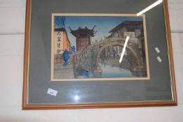 Japanese coloured wood block print of a bridge, framed and glazed