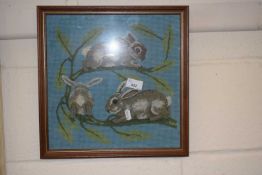 Tapestry picture of rabbits