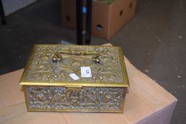 An embossed brass ware box