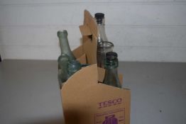 Seven vintage glass bottles