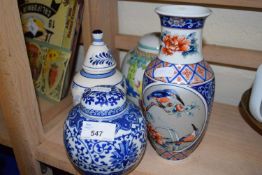 Chinese ginger jar together with a blue and white ginger jar and two others