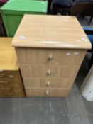 Light wood effect four drawer chest