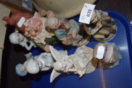 Eight assorted pottery and resin figures