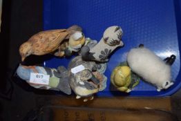 Seven assorted resin and pottery figures of birds and a sheep