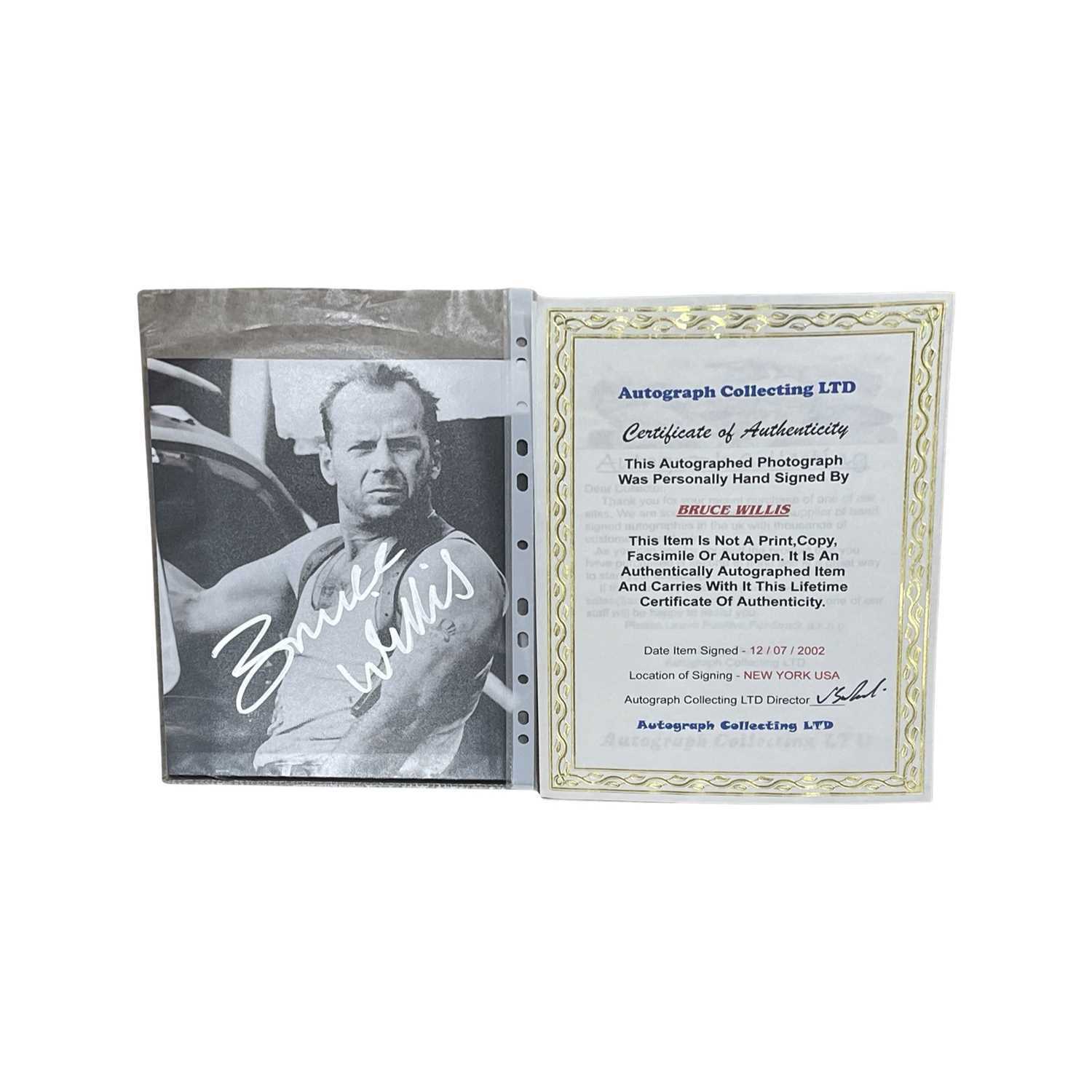 An 8x10" black and white photograph, bearing the signature of Bruce Willis (Die Hard, The Sixth