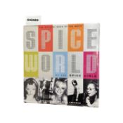 An autographed 1st Edition copy of Spice World: The Official Book of the Movie. Photography by