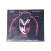 A Gene Simmons of KISS 12" vinyl LP, bearing the signature of Gene in silver pen to front