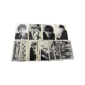 A collection of collectable cards by A&BC Chewing Gum Ltd, depicting the Beatles and their printed