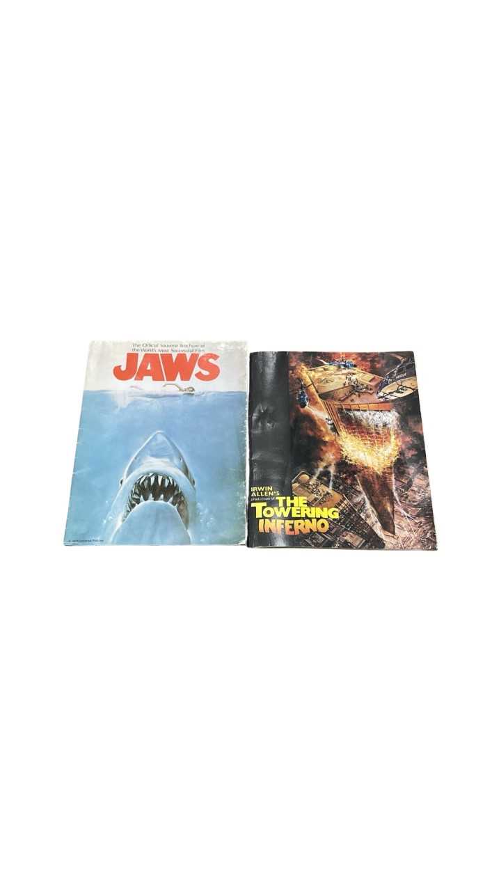 A pair of 1970s official souvenir film brochures, to include: - JAWS - The Towering Inferno