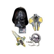 A mixed lot of modern Star Wars toys, to include: - Voice Changing Darth Vader 2-piece helmet -