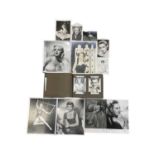 A photograph album containing a quantity of black and white photographs with facsimilie signatures